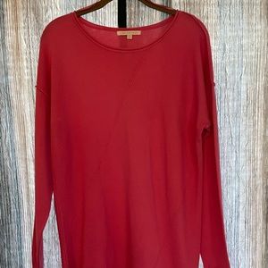 Pink sweater with asymmetrical hem